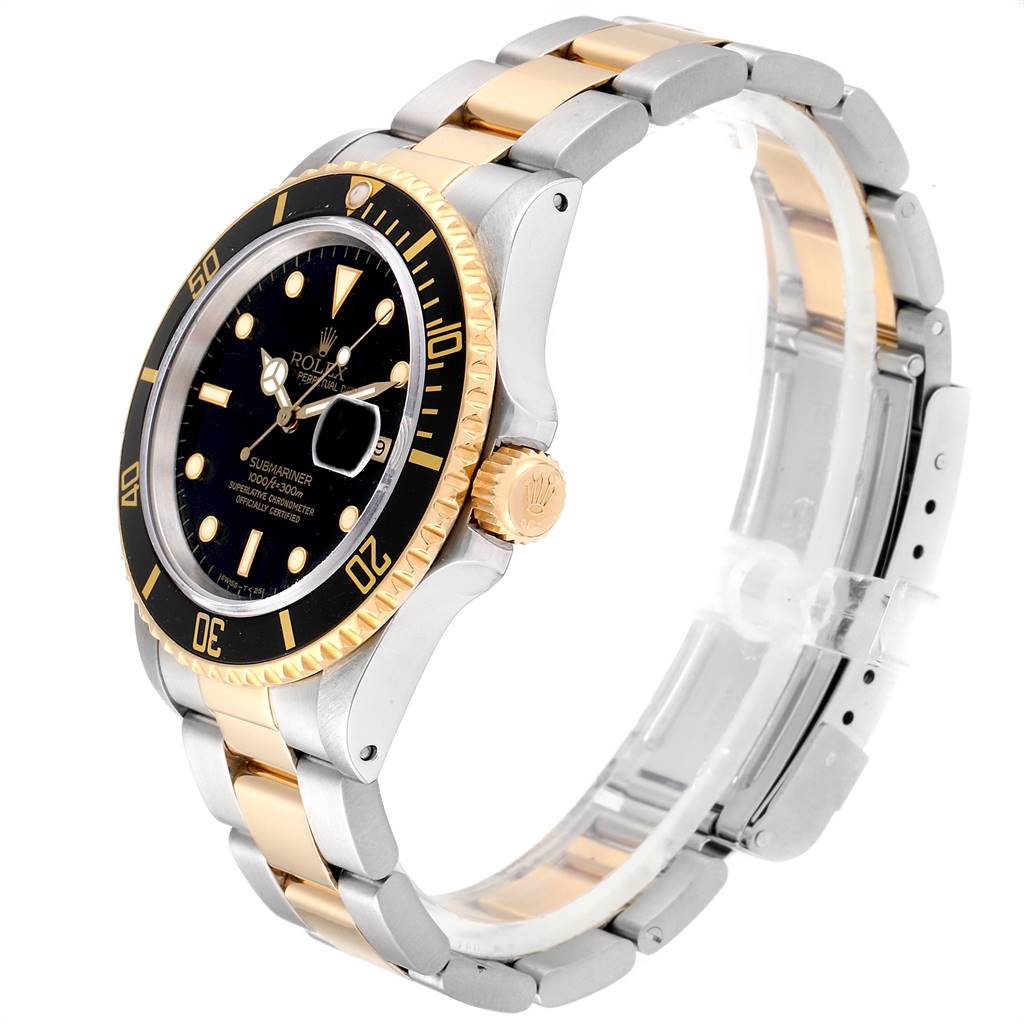 The image shows a side angle of a Rolex Submariner 16803 Men
s Steel and Gold (two tone) Black Dial 16803 Men
s Steel and Gold (two tone) Black Dial watch, highlighting its two-tone metal band, bezel, and crown.