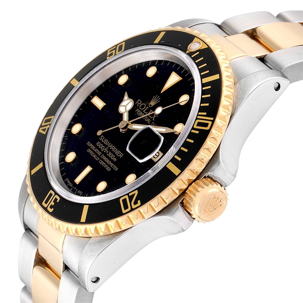 The image shows a close-up, angled view of the Rolex Submariner 16803 Men
s Steel and Gold (two tone) Black Dial 16803 Men
s Steel and Gold (two tone) Black Dial watch, highlighting its bezel, dial, and crown.