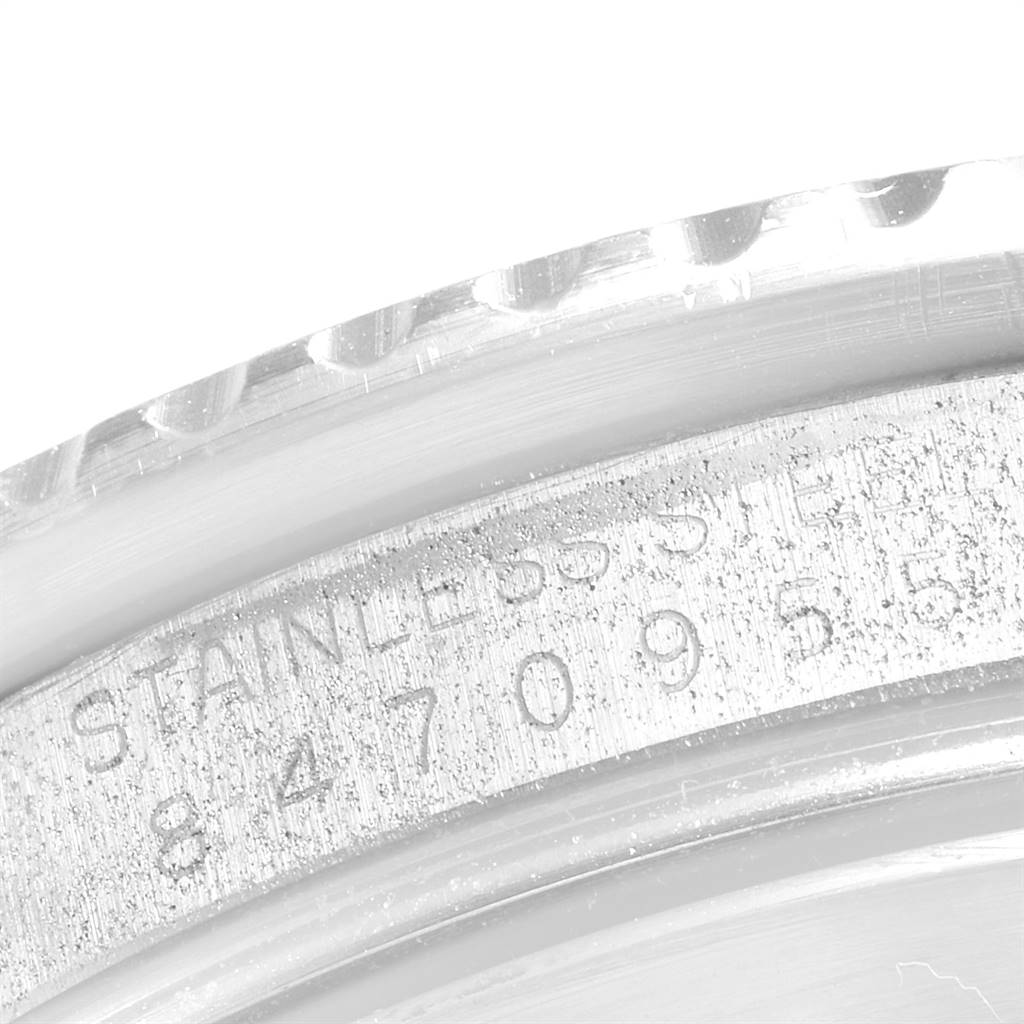 The image shows a close-up of the stainless steel engravings on the bezel and case back of a Rolex Submariner 16800 Men
s Stainless Steel Black Dial 16800 Men
s Stainless Steel Black Dial.