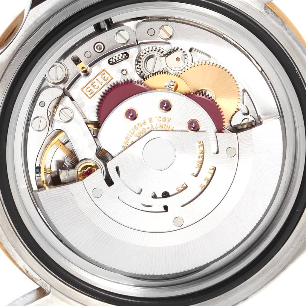 This image shows the intricate internal mechanism and movement of a Rolex Submariner 16613 Men
s Steel and Gold (two tone) Blue Dial 16613 Men
s Steel and Gold (two tone) Blue Dial watch from a rear angle.