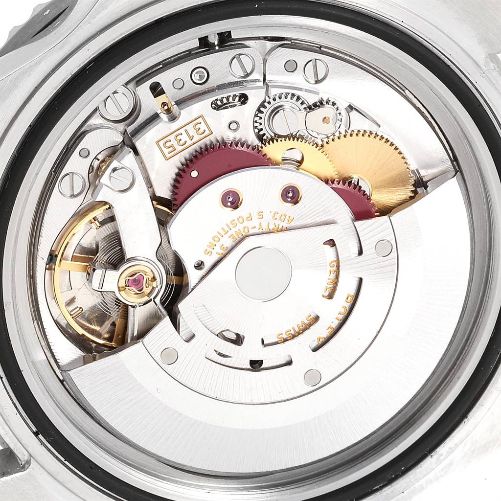 This image shows the intricate movement parts of a Rolex Submariner 16610LV Men
s Stainless Steel Black Dial 16610LV Men
s Stainless Steel Black Dial watch from a close-up, internal angle.