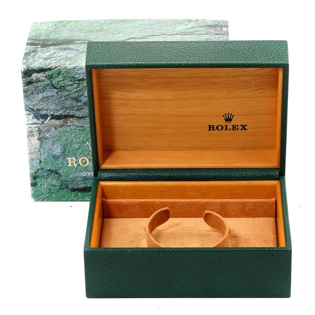 The image shows an open green Rolex watch box with "Rolex" and its logo inside, designed for the Submariner model.