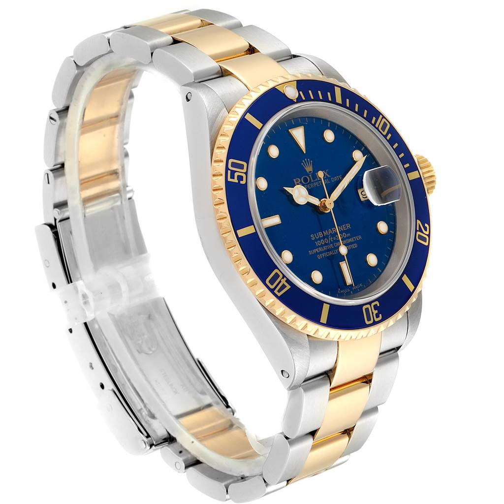 The Rolex Submariner 16613 Men
s Steel and Gold (two tone) Blue Dial 16613 Men
s Steel and Gold (two tone) Blue Dial watch is shown at a three-quarter angle, highlighting its blue dial, gold accents, and two-tone bracelet.
