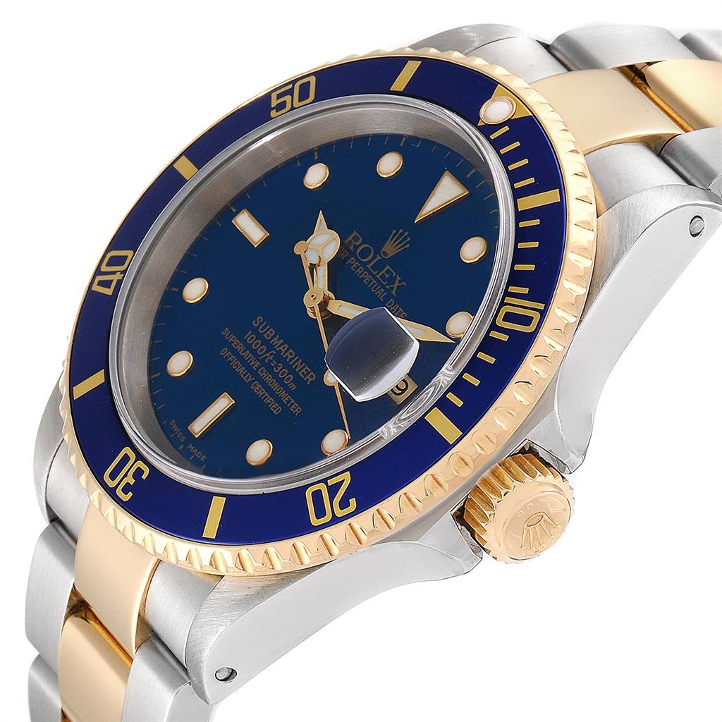 The image shows a side angle of the Rolex Submariner 16613 Men
s Steel and Gold (two tone) Blue Dial 16613 Men
s Steel and Gold (two tone) Blue Dial, highlighting its blue dial, gold bezel, and two-tone metal bracelet.