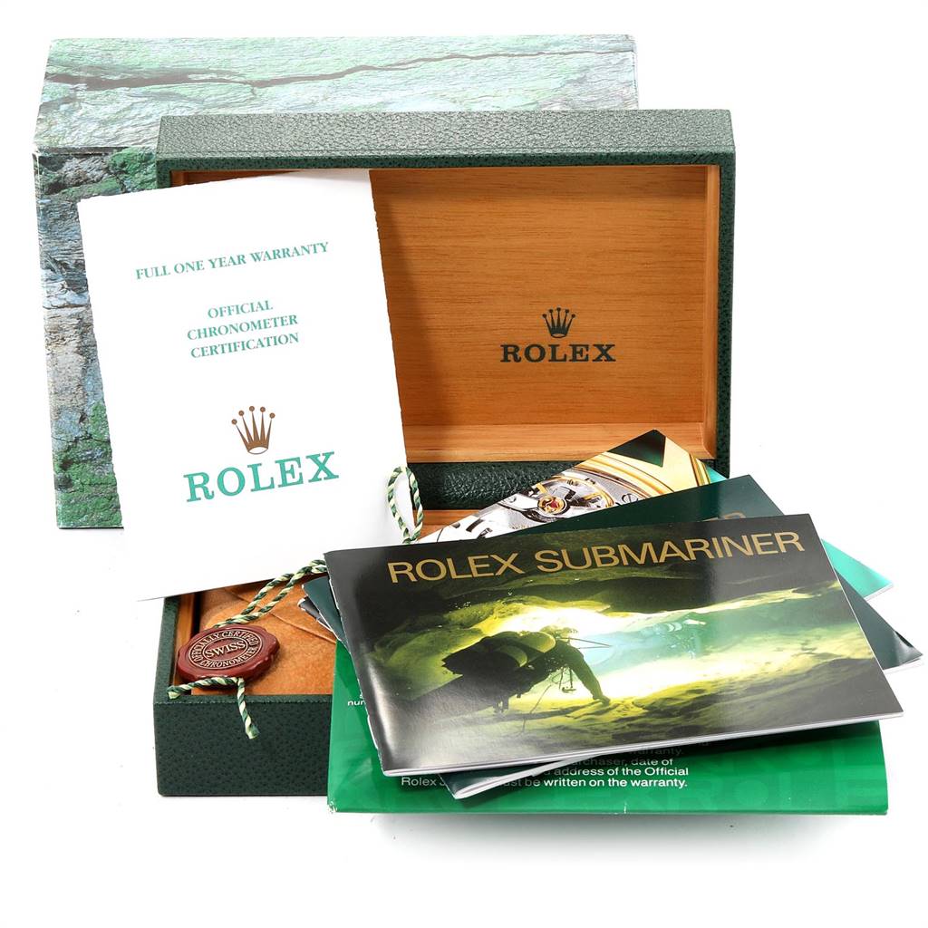 This image shows a Rolex Submariner 16613 Men's Steel and Gold (two tone) Black Dial 16613 Men's Steel and Gold (two tone) Black Dial watch box, warranty card, manuals, and official chronometer certification.