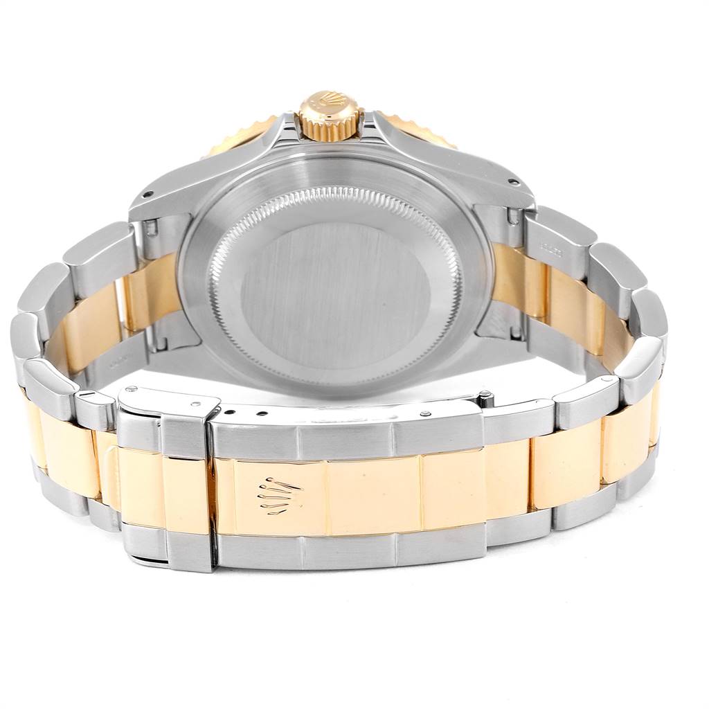 The image displays the back view of a Rolex Submariner 16613 Men's Steel and Gold (two tone) Black Dial 16613 Men's Steel and Gold (two tone) Black Dial watch, highlighting the case back, crown, and two-tone bracelet.