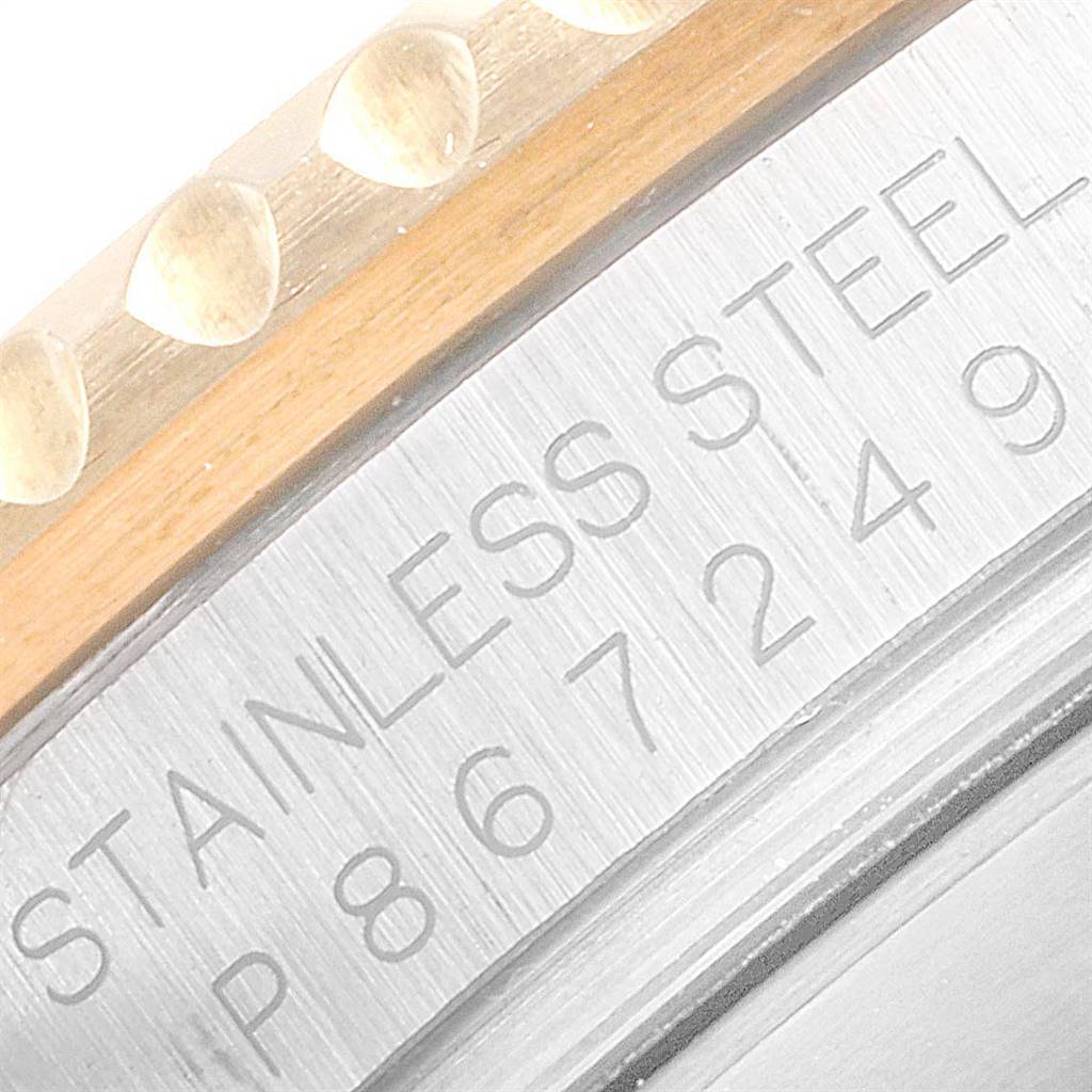 This close-up shot of the Rolex Submariner 16613 Men
s Steel and Gold (two tone) Blue Dial 16613 Men
s Steel and Gold (two tone) Blue Dial shows the side of the stainless steel case with the serial number and part of the bezel.