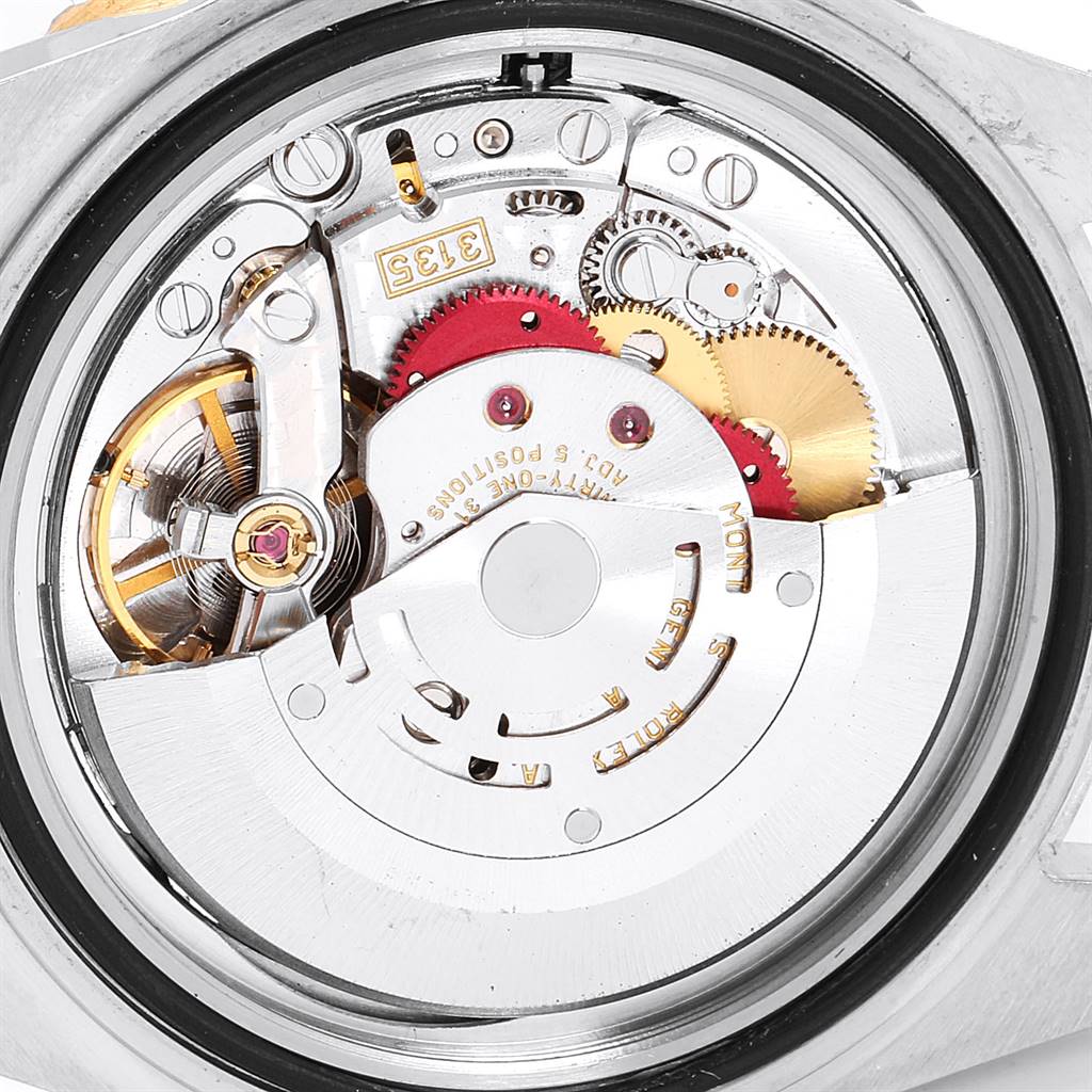 The image shows the detailed internal mechanism of a Rolex Submariner 16613 Men
s Steel and Gold (two tone) Blue Dial 16613 Men
s Steel and Gold (two tone) Blue Dial watch from the rear angle.