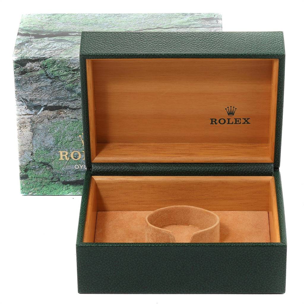 The image shows an open Rolex Submariner 16613 Men
s Steel and Gold (two tone) Blue Dial 16613 Men
s Steel and Gold (two tone) Blue Dial watch box with a green exterior and beige interior.