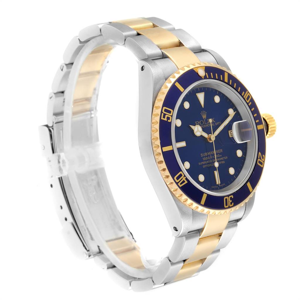 The image shows a Rolex Submariner 16613 Men
s Steel and Gold (two tone) Blue Dial 16613 Men
s Steel and Gold (two tone) Blue Dial watch at a slight angle, highlighting the two-tone bracelet, blue dial, and bezel.
