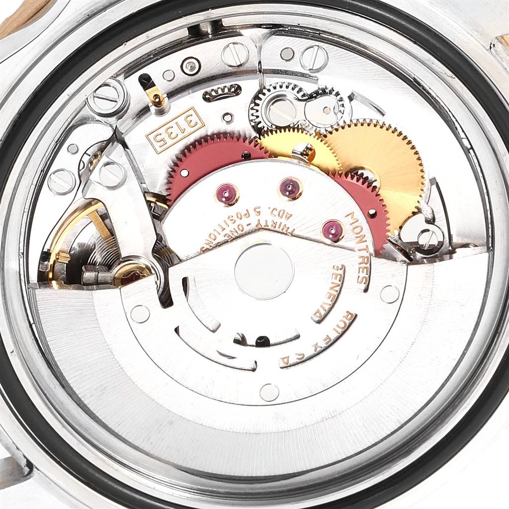 The image shows a close-up of the movement and internal mechanisms of a Rolex Submariner 16613 Men
s Steel and Gold (two tone) Grey Dial 16613 Men
s Steel and Gold (two tone) Grey Dial watch.