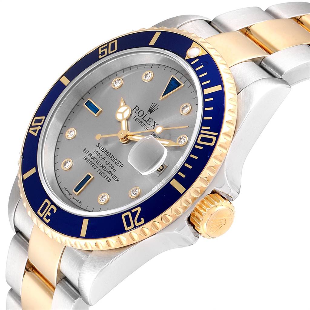 This image shows a side angle view of the Rolex Submariner 16613 Men
s Steel and Gold (two tone) Grey Dial 16613 Men
s Steel and Gold (two tone) Grey Dial watch highlighting the bezel, dial, and part of the bracelet.