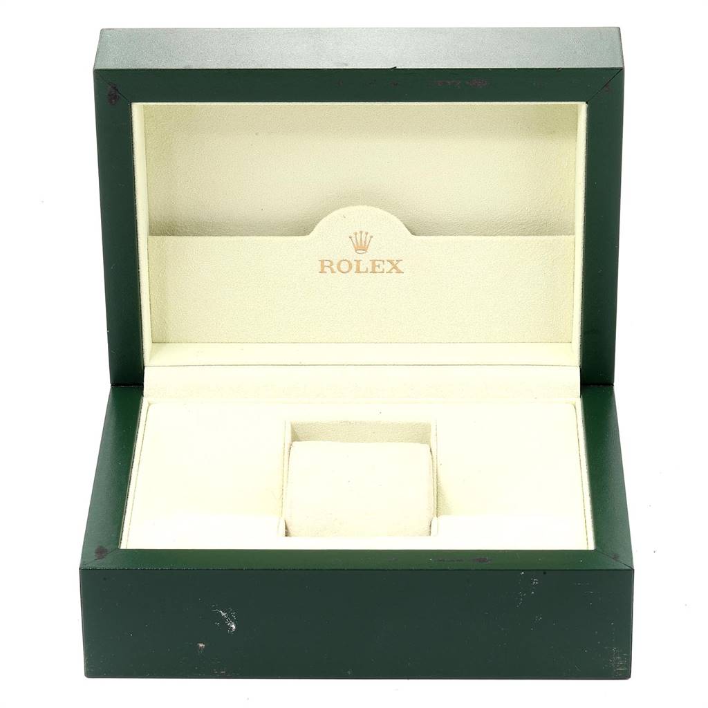 This image shows an empty Rolex Submariner 16613 Men
s Steel and Gold (two tone) Grey Dial 16613 Men
s Steel and Gold (two tone) Grey Dial watch box, open, with its green exterior and beige interior.