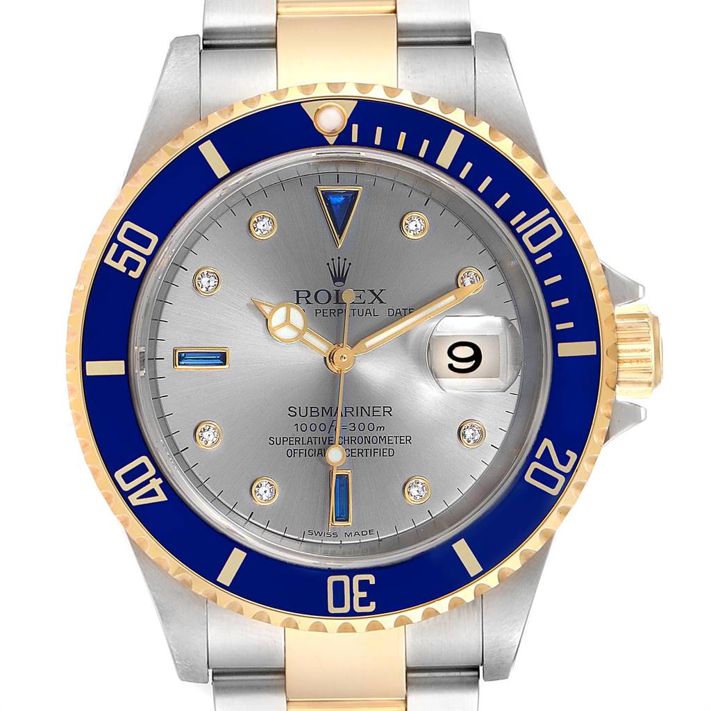 The Rolex Submariner 16613 Men
s Steel and Gold (two tone) Grey Dial 16613 Men
s Steel and Gold (two tone) Grey Dial watch is shown from a front angle, displaying its face, bezel, and part of the bracelet.