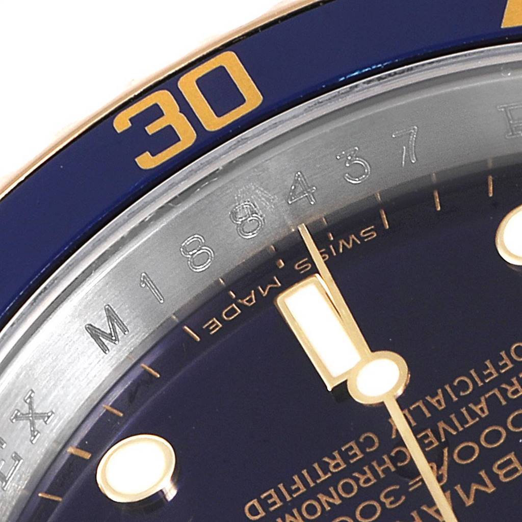 This close-up captures the dial, bezel, and part of the text on the Rolex Submariner 16613 Men
s Steel and Gold (two tone) Blue Dial 16613 Men
s Steel and Gold (two tone) Blue Dial watch.