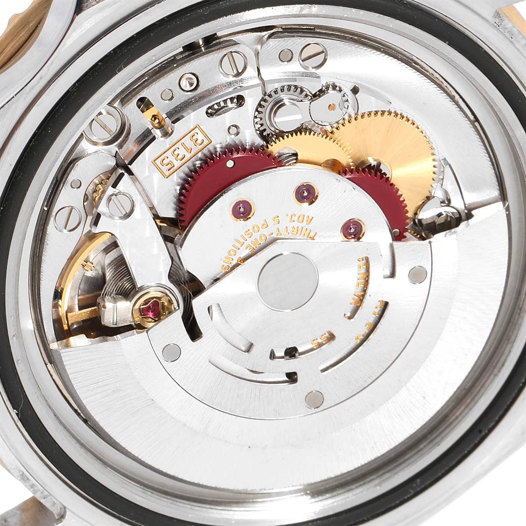 The image shows the internal mechanical movement of a Rolex Submariner 16613 Men
s Steel and Gold (two tone) Blue Dial 16613 Men
s Steel and Gold (two tone) Blue Dial watch, viewed from the back.