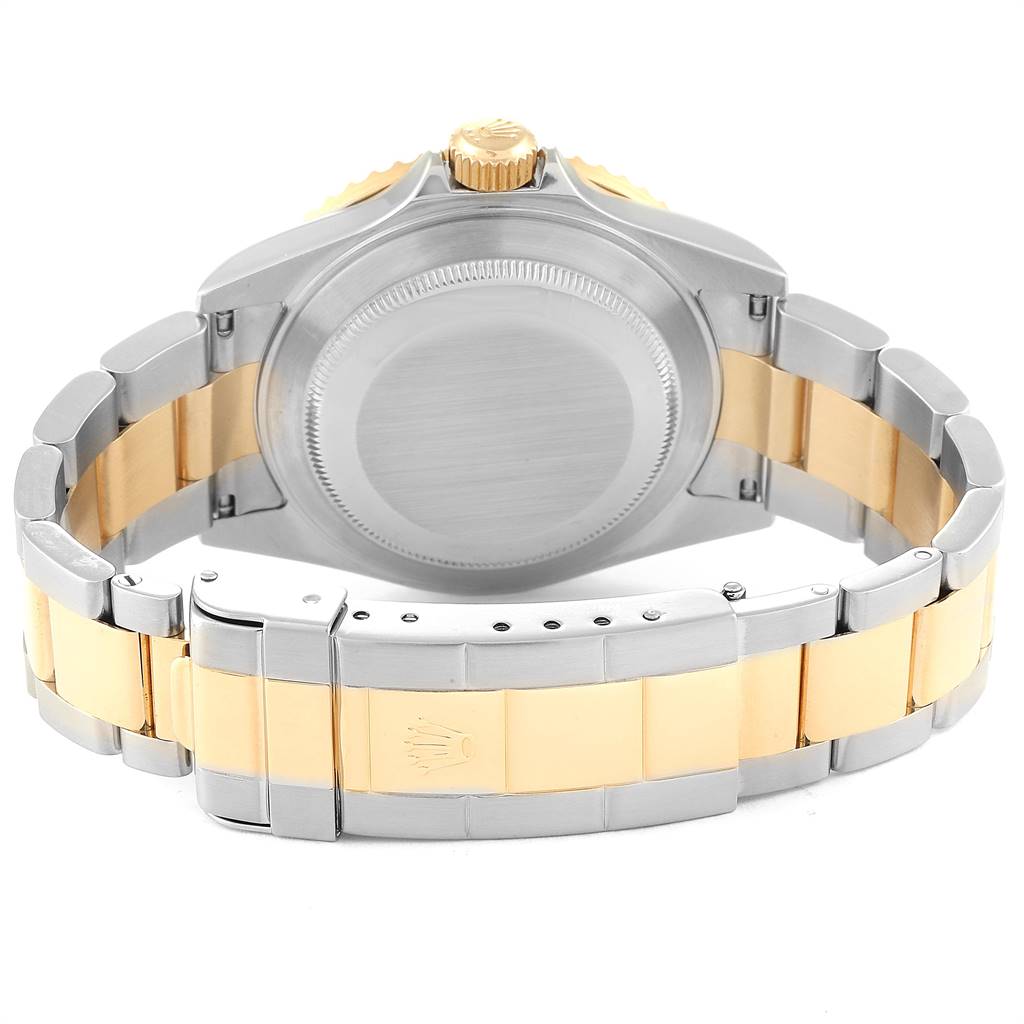 This image shows the back and bracelet clasp of a Rolex Submariner 16613 Men
s Steel and Gold (two tone) Blue Dial 16613 Men
s Steel and Gold (two tone) Blue Dial watch, highlighting its two-tone design.