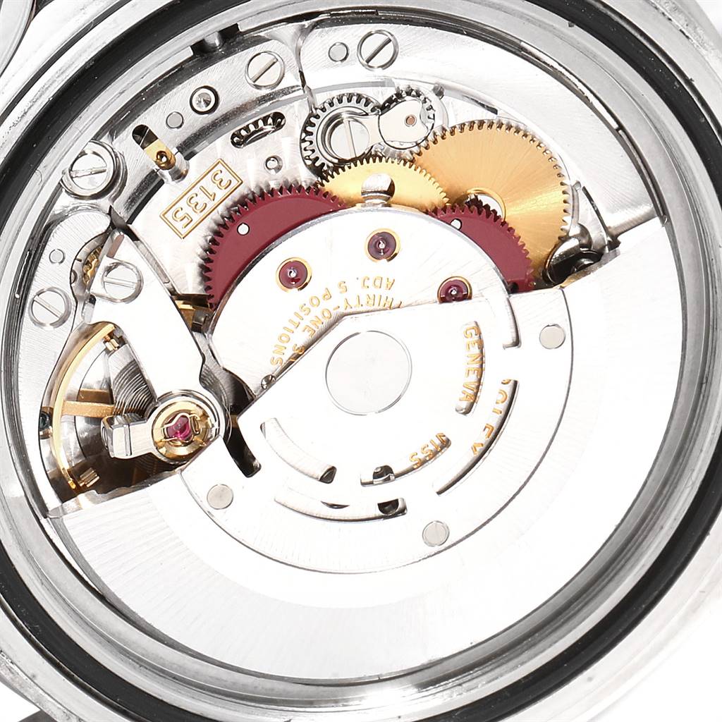 This image shows a close-up of the internal mechanism of a Rolex Submariner 16610 Men
s Stainless Steel Black Dial 16610 Men
s Stainless Steel Black Dial watch, highlighting gears and components.