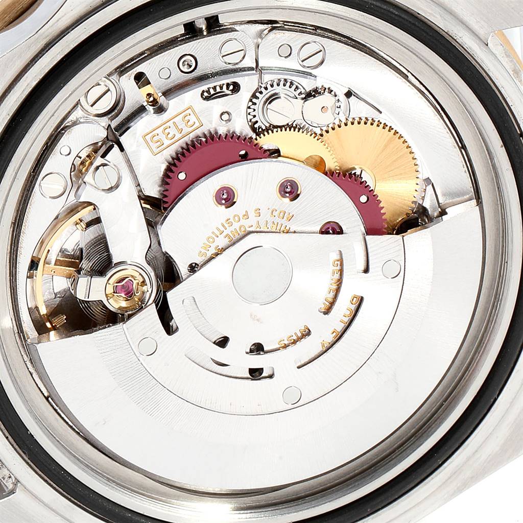 This image shows the internal movement mechanism of a Rolex Submariner 16613 Men
s Steel and Gold (two tone) Champagne Dial 16613 Men
s Steel and Gold (two tone) Champagne Dial watch from a close-up angle.