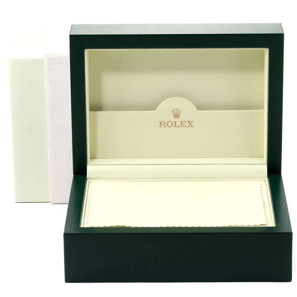 This image shows the open green box and beige interior of a Rolex Submariner 16613 Men
s Steel and Gold (two tone) Champagne Dial 16613 Men
s Steel and Gold (two tone) Champagne Dial watch.