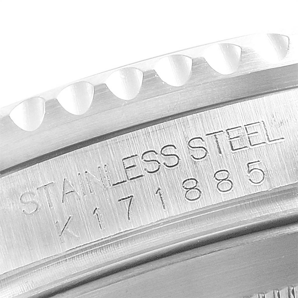 This close-up image shows the engraved stainless steel casing of a Rolex Submariner 16610 Men
s Stainless Steel Black Dial 16610 Men
s Stainless Steel Black Dial watch with a partially visible serial number.
