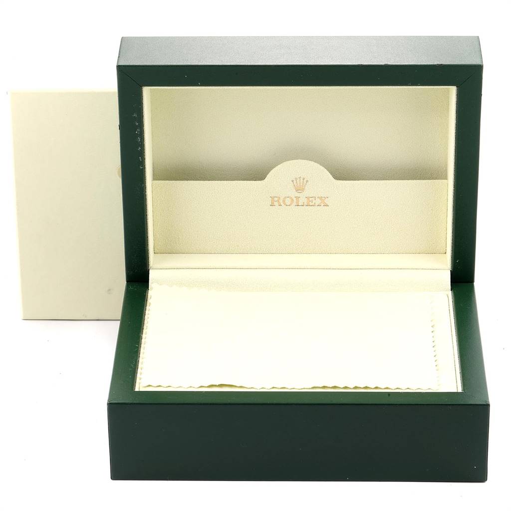 The image shows a Rolex Submariner 16610 Men
s Stainless Steel Black Dial 16610 Men
s Stainless Steel Black Dial watch box open with its cushion and cover, displaying the inner lid with the Rolex logo.