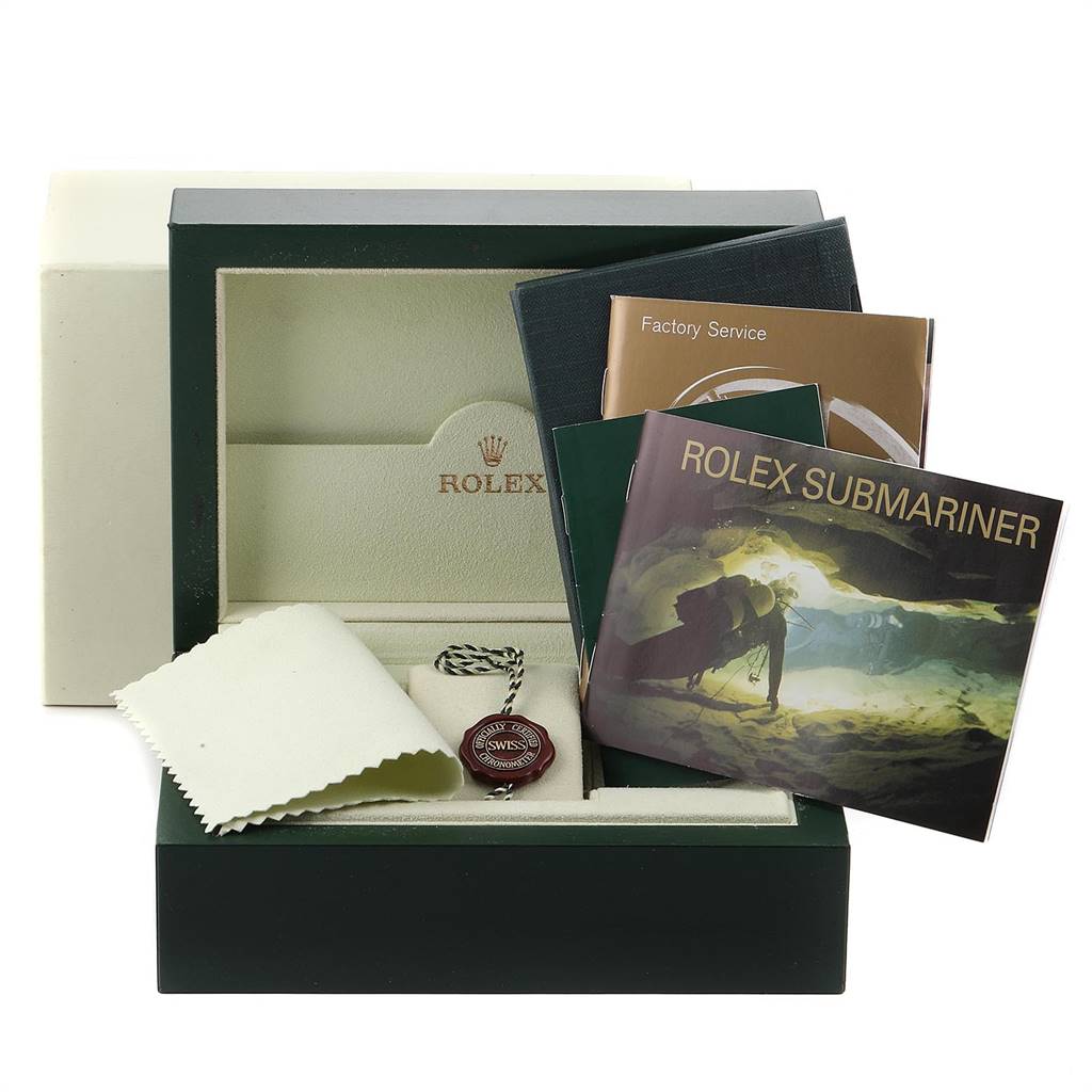 This image shows a Rolex Submariner 16610 Men
s Stainless Steel Black Dial 16610 Men
s Stainless Steel Black Dial box set with manuals, a tag, and a cloth, viewed from the front.