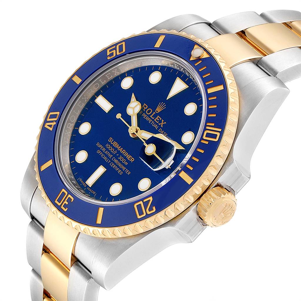 The image shows a side angle of a Rolex Submariner 116613 Men
s Steel and Gold (two tone) Blue Dial 116613 Men
s Steel and Gold (two tone) Blue Dial watch, highlighting its blue dial, bezel, and two-tone band.