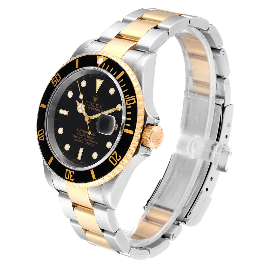 The image shows a Rolex Submariner 16613 Men
s Steel and Gold (two tone) Black Dial 16613 Men
s Steel and Gold (two tone) Black Dial watch at a three-quarter angle, highlighting its black dial, gold accents, and two-tone bracelet.