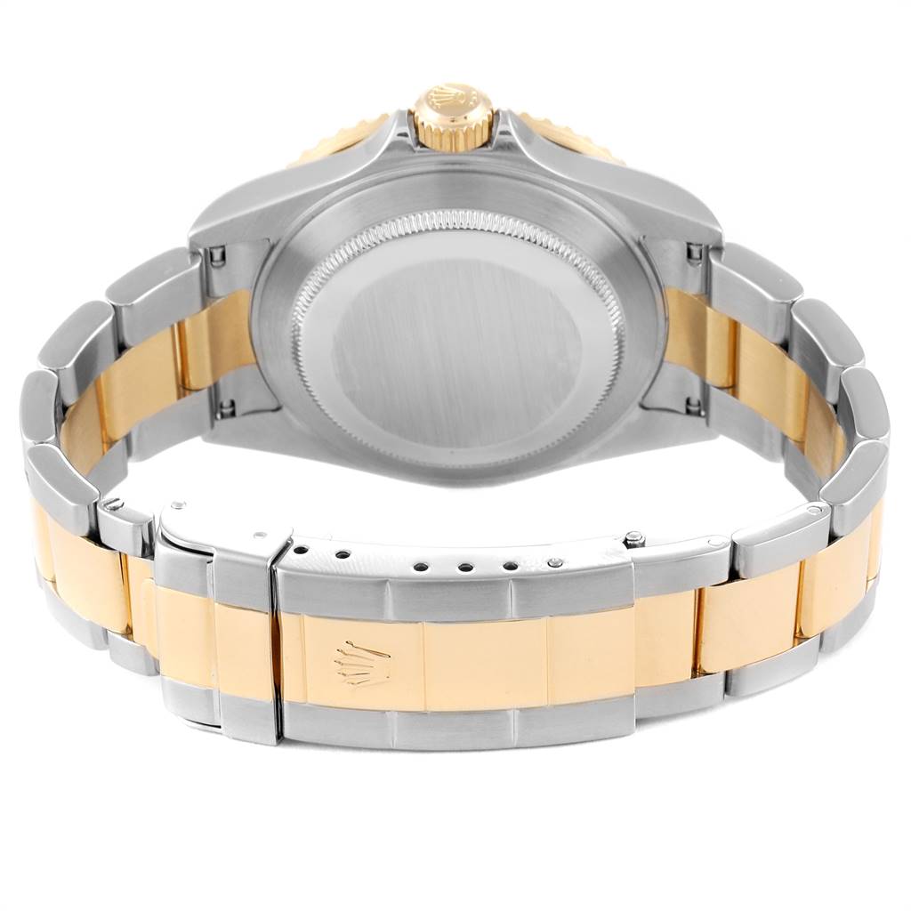 The image shows the back view of a Rolex Submariner 16613 Men
s Steel and Gold (two tone) Black Dial 16613 Men
s Steel and Gold (two tone) Black Dial watch, highlighting its bracelet, clasp, and case back.