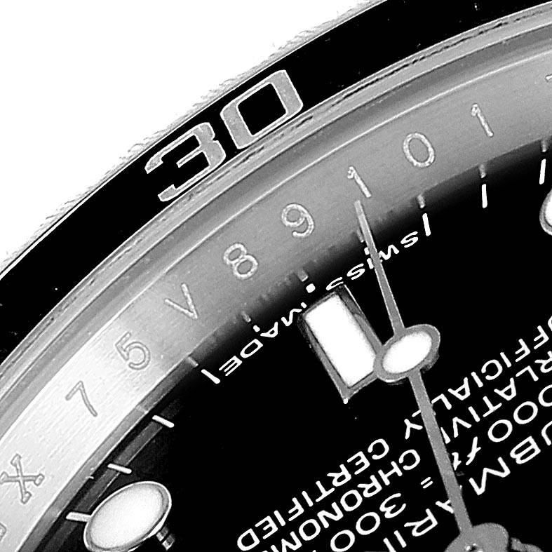 The close-up shows the bezel, the Swiss movement indicator, and part of the dial of a Rolex Submariner 14060M Men
s Stainless Steel Black Dial 14060M Men
s Stainless Steel Black Dial watch.