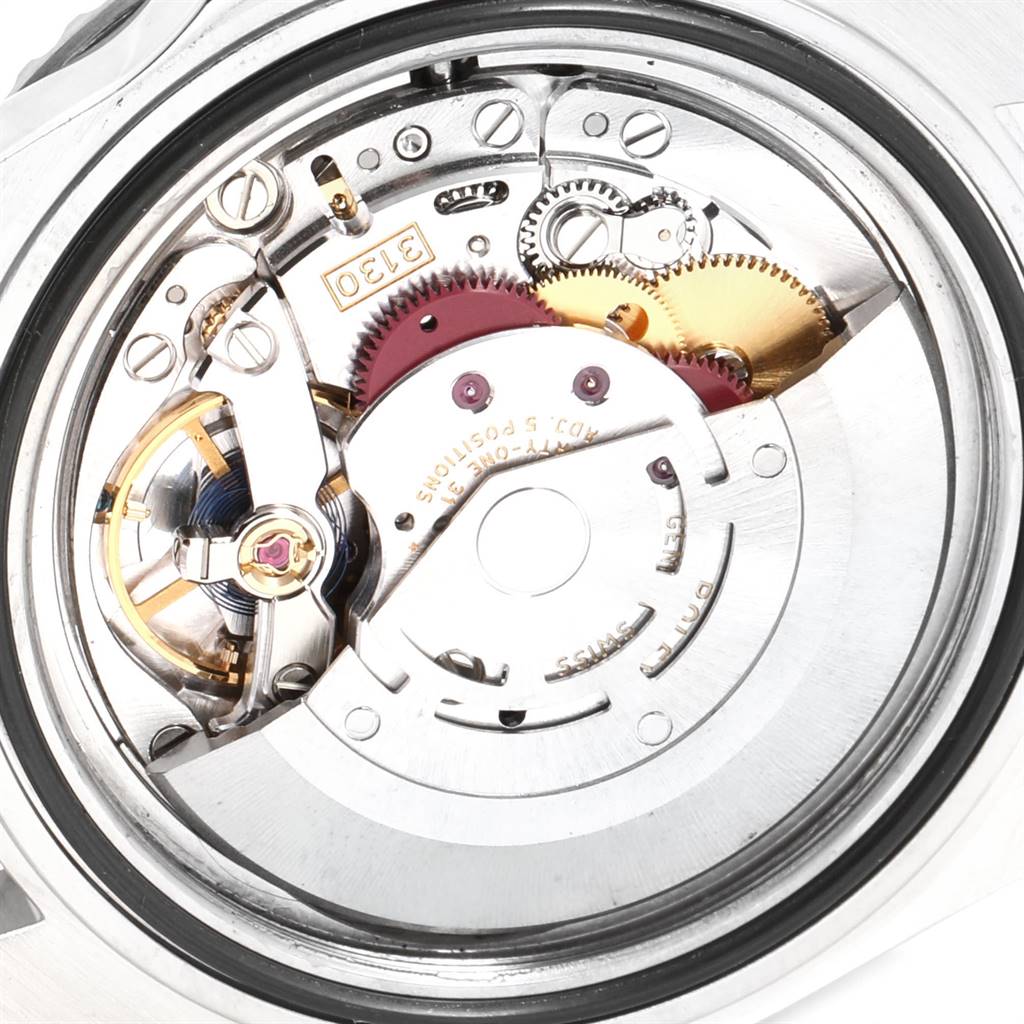 This image shows the intricate internal mechanism of a Rolex Submariner 14060M Men
s Stainless Steel Black Dial 14060M Men
s Stainless Steel Black Dial watch, viewed from the back.