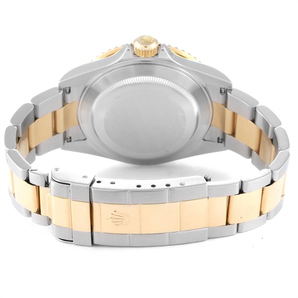 The image shows the back case and bracelet of a Rolex Submariner 16613 Men
s Steel and Gold (two tone) Grey Dial 16613 Men
s Steel and Gold (two tone) Grey Dial watch from a rear angle.