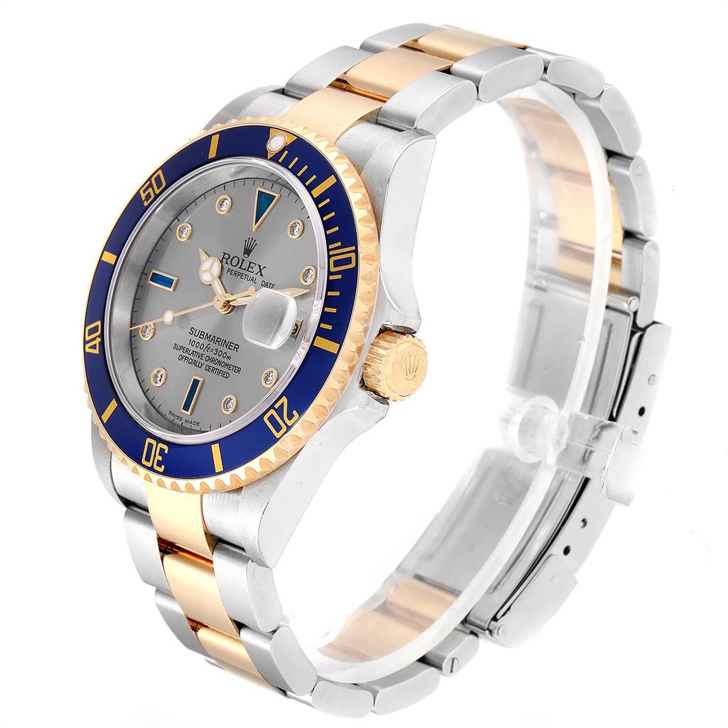 This image shows the Rolex Submariner 16613 Men
s Steel and Gold (two tone) Grey Dial 16613 Men
s Steel and Gold (two tone) Grey Dial watch from a three-quarter angle, displaying its face, bezel, and bracelet.