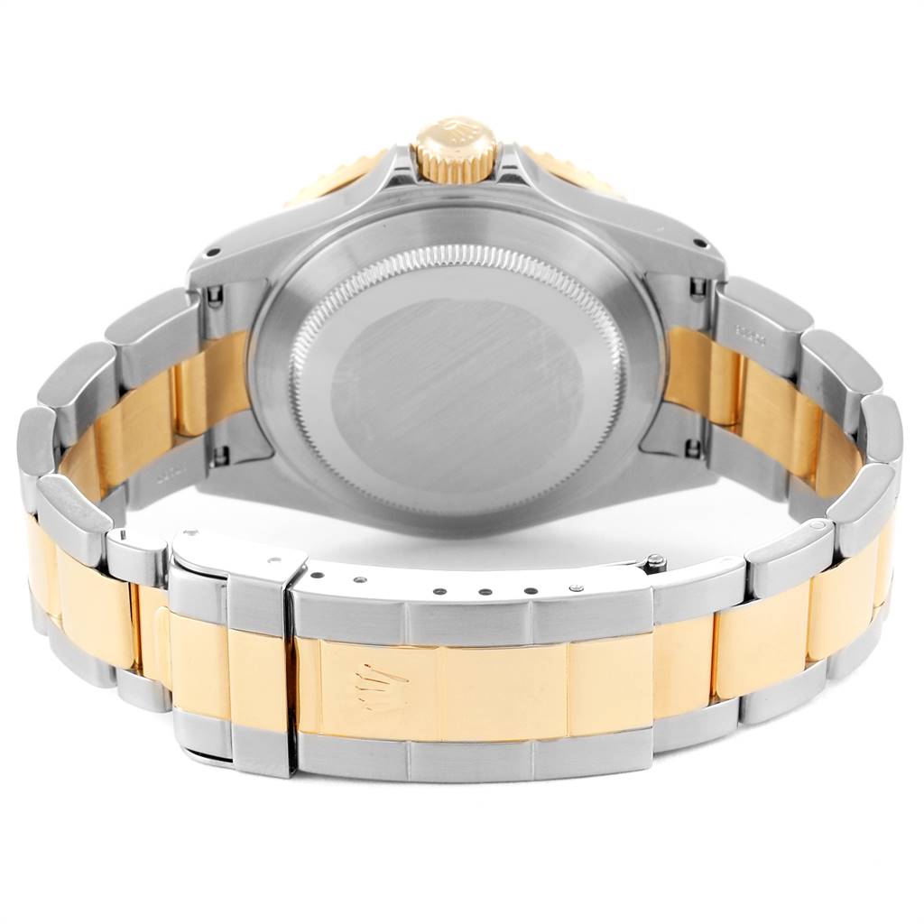 This image shows the back of a Rolex Submariner 16613 Men
s Steel and Gold (two tone) Blue Dial 16613 Men
s Steel and Gold (two tone) Blue Dial watch and part of its bracelet.