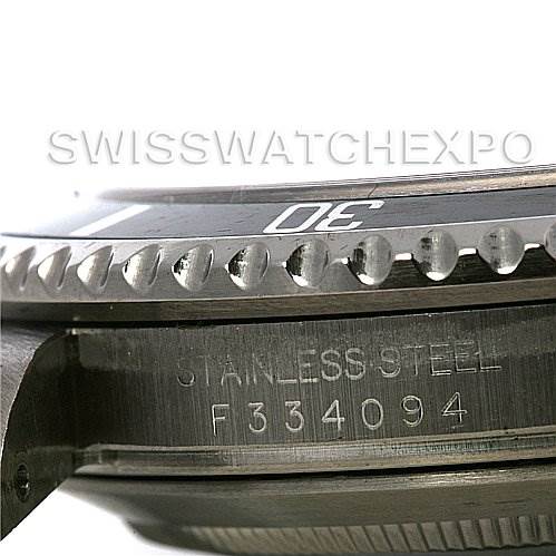 The image shows a close-up side view of the bezel and case edge of a Rolex Submariner 16610 Men's Stainless Steel Black Dial 16610 Men's Stainless Steel Black Dial watch, with part of the serial number visible.