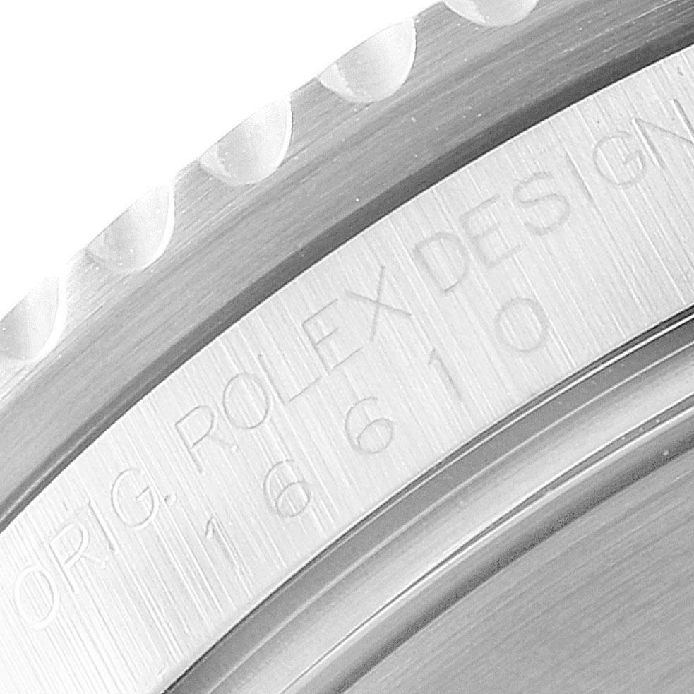 The image shows a close-up of the bezel and engraved model number of a Rolex Submariner 16610 Men
s Stainless Steel Black Dial 16610 Men
s Stainless Steel Black Dial watch.