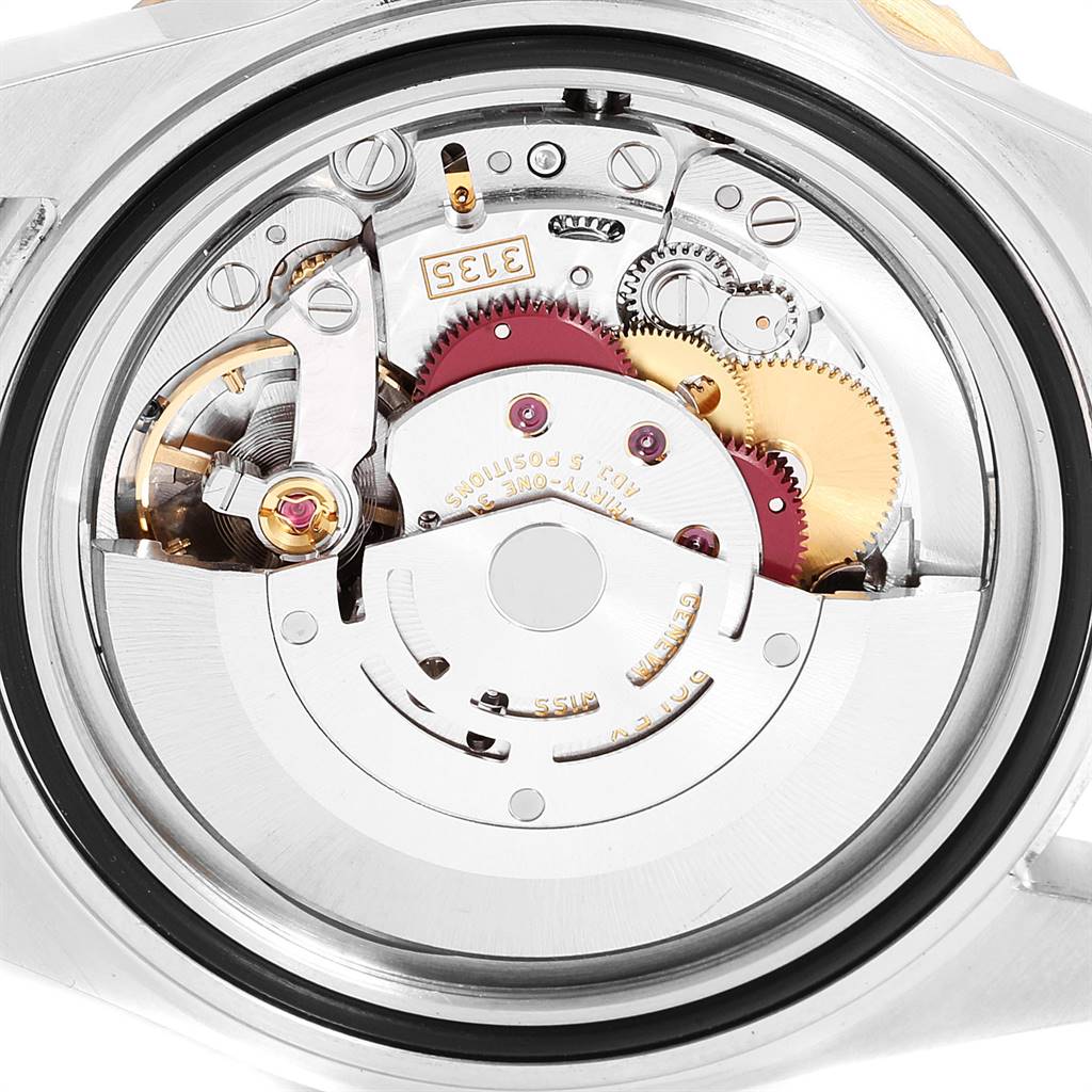 This image shows the intricate internal mechanical movement of a Rolex Submariner 16613 Men
s Steel and Gold (two tone) Blue Dial 16613 Men
s Steel and Gold (two tone) Blue Dial watch, viewed from the back case.
