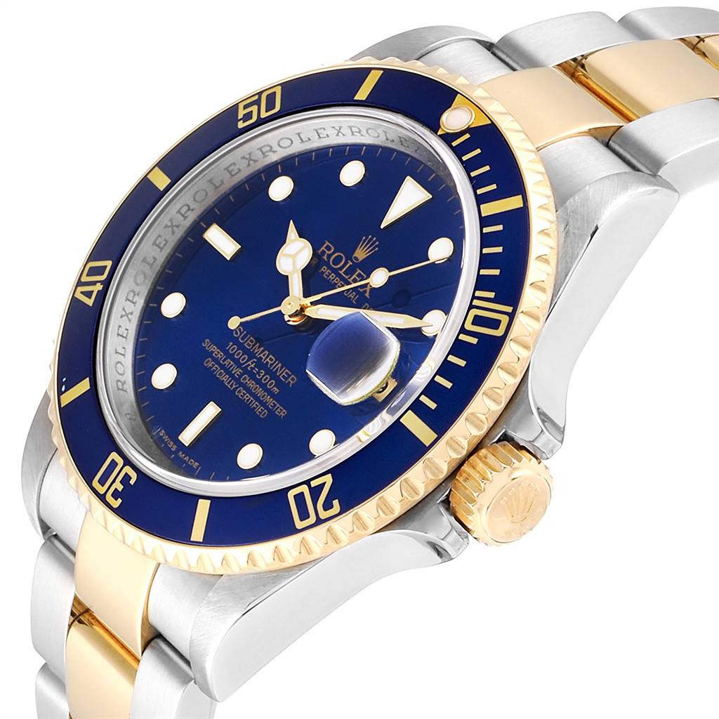 The image shows a close-up, angled view of a Rolex Submariner 16613 Men
s Steel and Gold (two tone) Blue Dial 16613 Men
s Steel and Gold (two tone) Blue Dial, highlighting the blue dial, bezel, and two-tone bracelet.