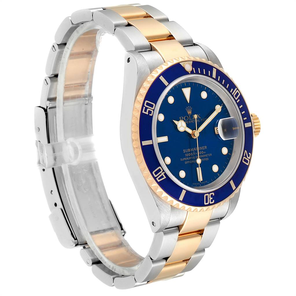 This Rolex Submariner 16613 Men
s Steel and Gold (two tone) Blue Dial 16613 Men
s Steel and Gold (two tone) Blue Dial watch is shown at a three-quarter angle, highlighting the blue dial, bezel, and two-tone bracelet.