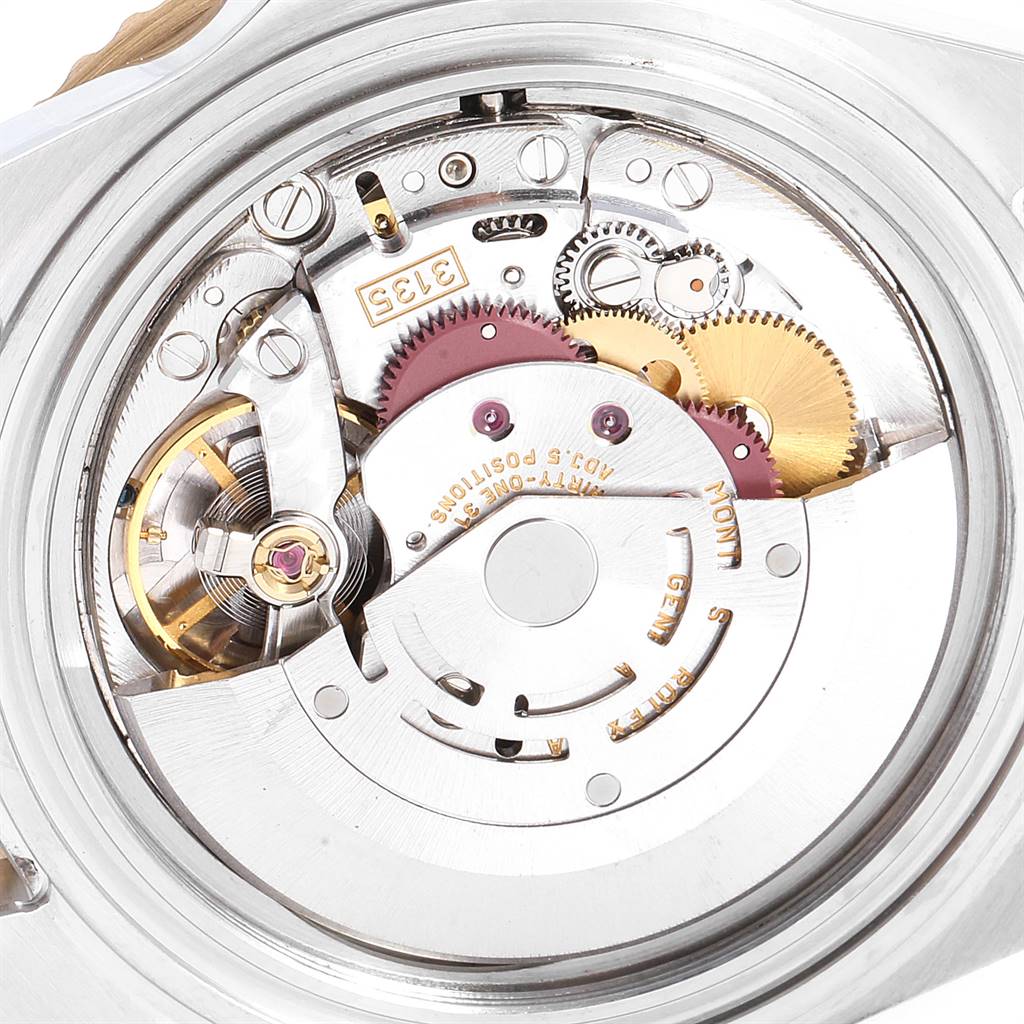 This image shows the internal mechanical movement of a Rolex Submariner 16613 Men
s Steel and Gold (two tone) Blue Dial 16613 Men
s Steel and Gold (two tone) Blue Dial watch, featuring various gears, springs, and components.