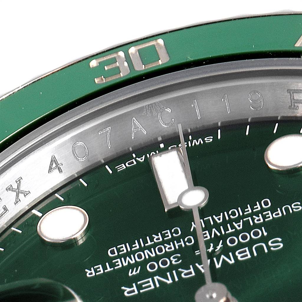 This image shows a close-up of the bezel, dial, and the serial number area of the Rolex Submariner 116610LV Men
s Stainless Steel Green Dial 116610LV Men
s Stainless Steel Green Dial watch.