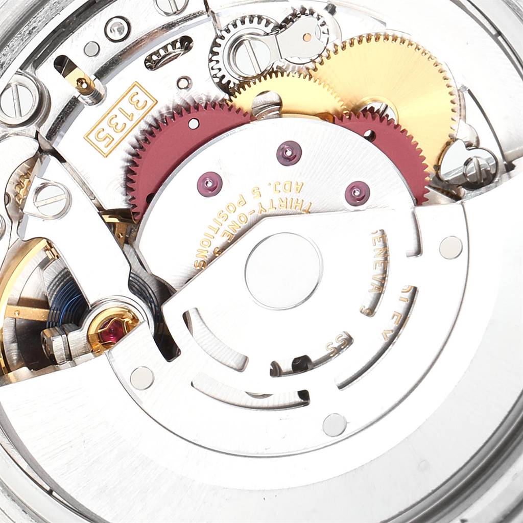 This is a close-up image of the internal movement components of a Rolex Submariner 116610LV Men
s Stainless Steel Green Dial 116610LV Men
s Stainless Steel Green Dial watch.