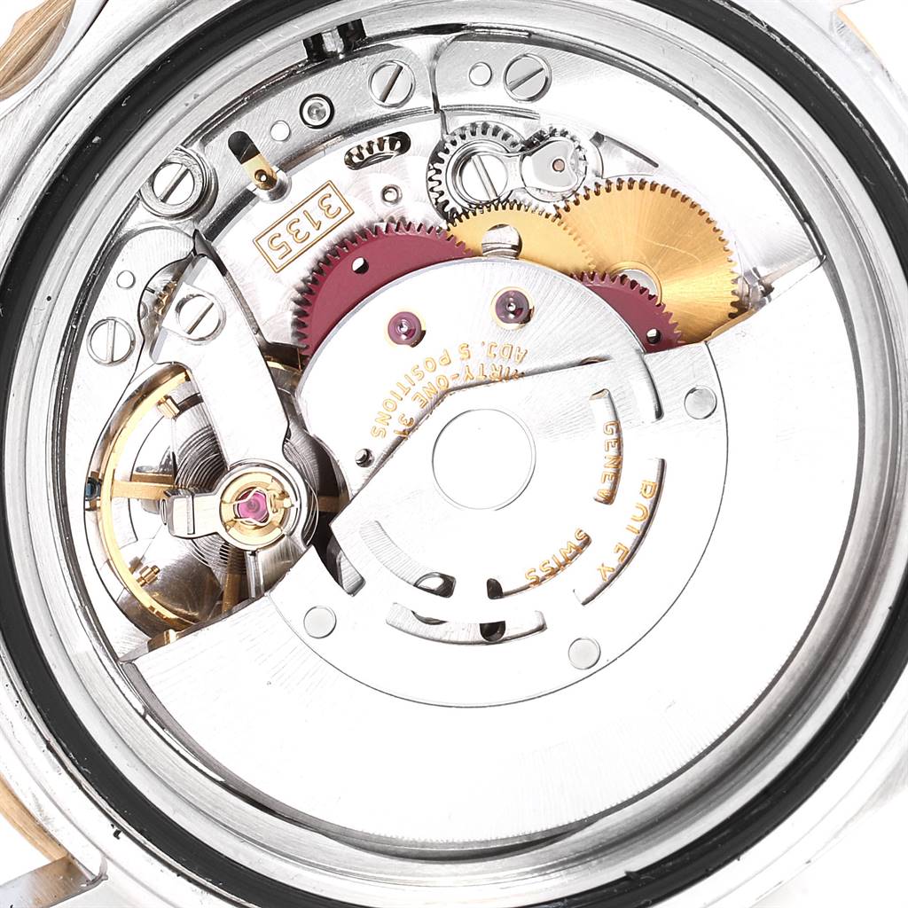 This image shows the intricate internal mechanism of a Rolex Submariner 16613 Men
s Steel and Gold (two tone) Black Dial 16613 Men
s Steel and Gold (two tone) Black Dial watch from a rear angle.