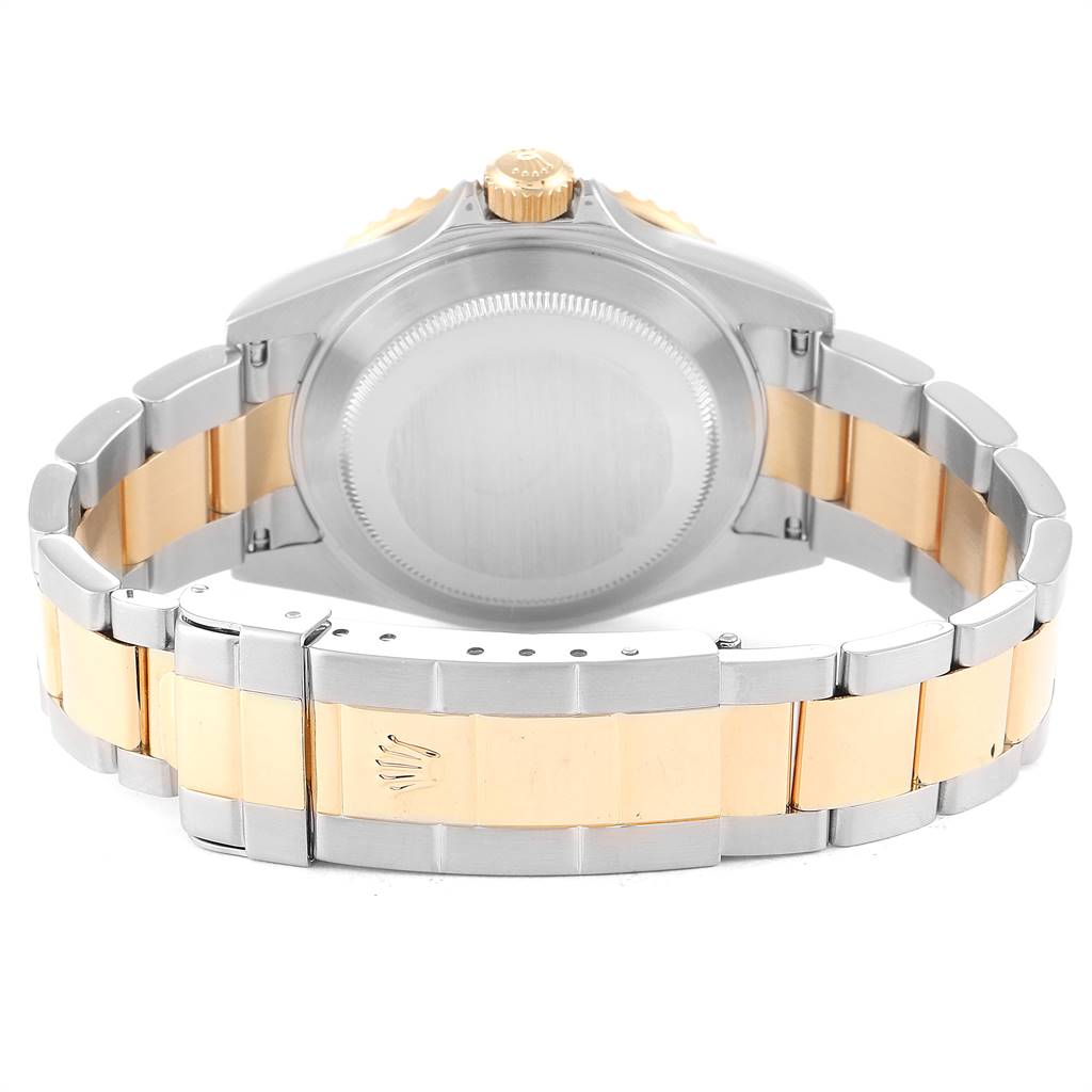 This image shows the back case and bracelet of a Rolex Submariner 16613 Men
s Steel and Gold (two tone) Black Dial 16613 Men
s Steel and Gold (two tone) Black Dial watch, highlighting the two-tone metal design.