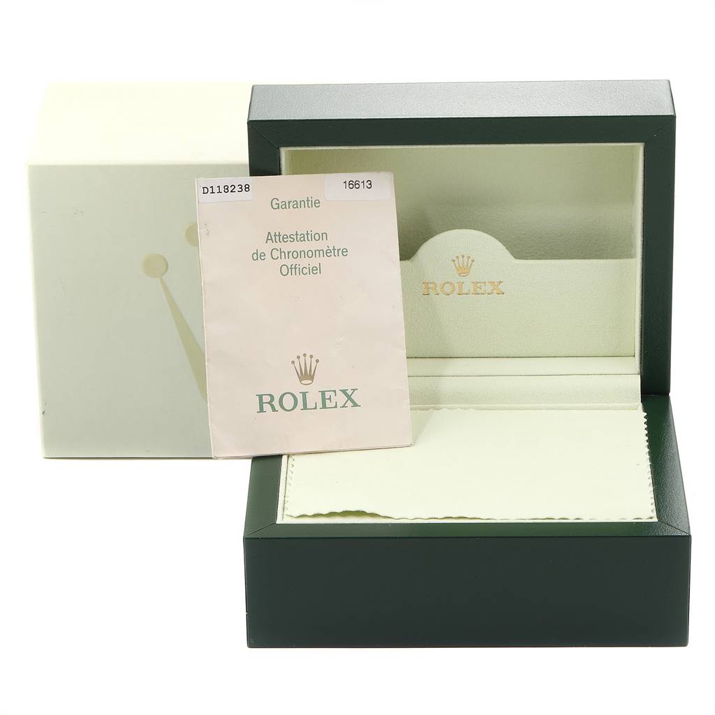 This image shows the packaging and warranty certificate of the Rolex Submariner 16613 Men
s Steel and Gold (two tone) Blue Dial 16613 Men
s Steel and Gold (two tone) Blue Dial, including its open box and instruction manual.