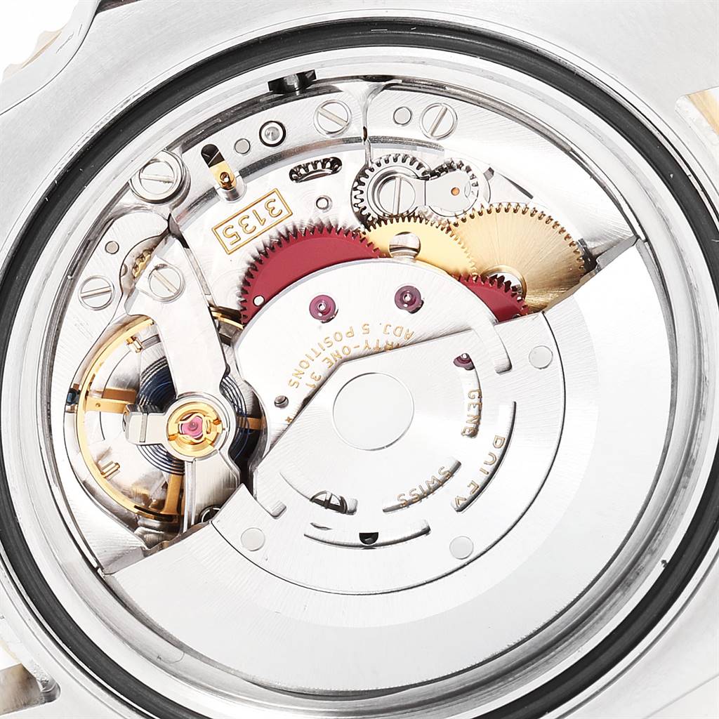 This image shows the internal mechanical movement of a Rolex Submariner 116613 Men's Steel and Gold (two tone) Black Dial 116613 Men's Steel and Gold (two tone) Black Dial watch from a close-up, rear angle.