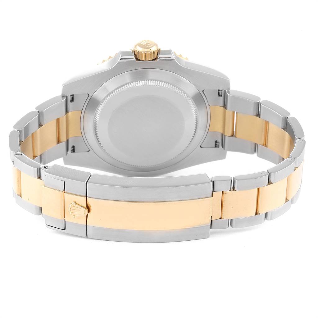 This image shows the back of a Rolex Submariner 116613 Men's Steel and Gold (two tone) Black Dial 116613 Men's Steel and Gold (two tone) Black Dial watch, highlighting the case back and two-tone bracelet.