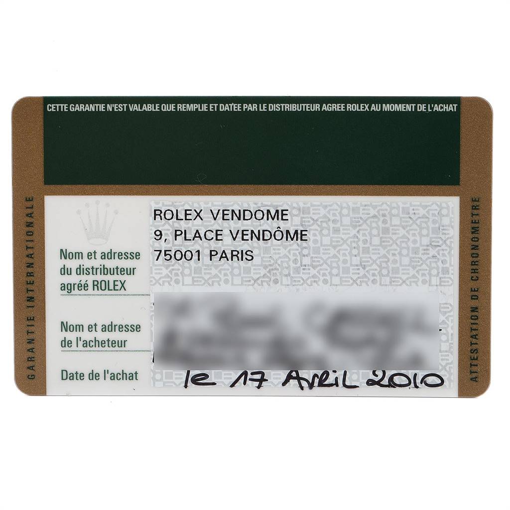 This is a close-up image of a warranty card for a Rolex Submariner 116613 Men
s Steel and Gold (two tone) Black Dial 116613 Men
s Steel and Gold (two tone) Black Dial watch, showcasing its dealer information and purchase date.