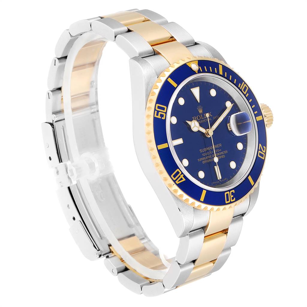 The image shows a Rolex Submariner 16613 Men
s Steel and Gold (two tone) Blue Dial 16613 Men
s Steel and Gold (two tone) Blue Dial watch at a three-quarter angle, highlighting the blue dial, bezel, and two-tone bracelet.